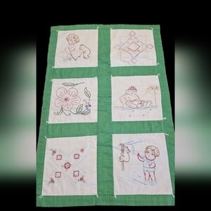  vintage, handmade embroidered baby quilt featuring various childhood-themed